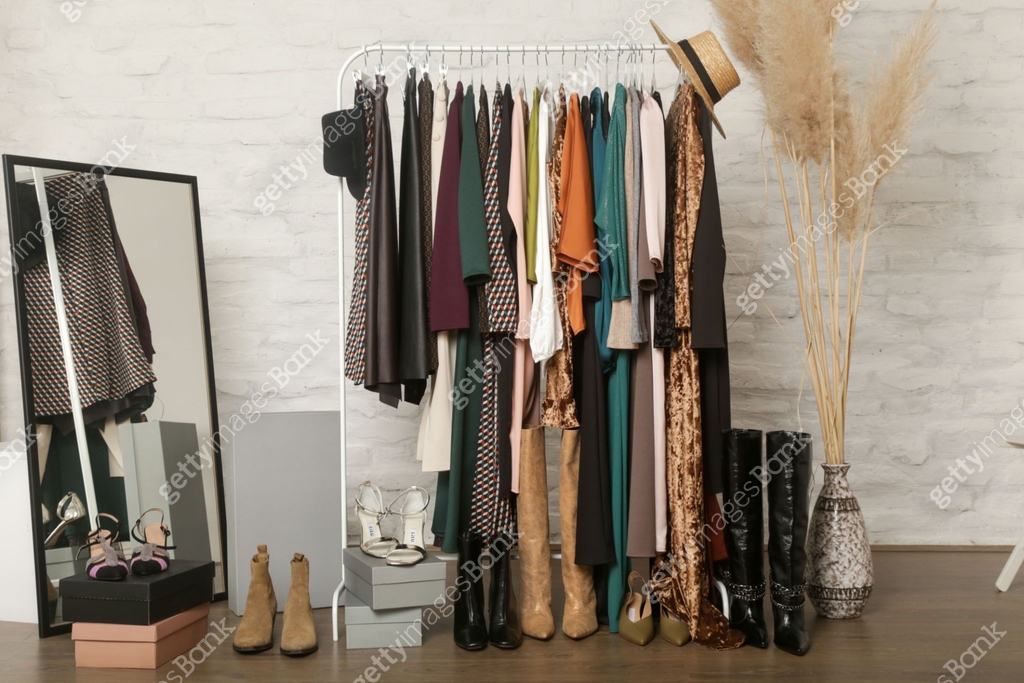 Women's clothes and shoes. Clothes rack with stylish and elegant ...