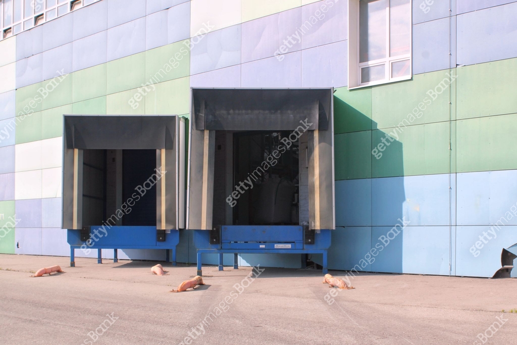 Modern loading docks for trucks. Loading zone in industry building ...
