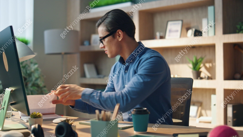 Inspired man checking notebook flipping pages office. Businessman ...