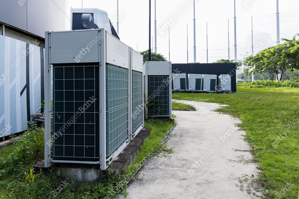 Air conditioner compressor installed in old building. Outdoor split ...