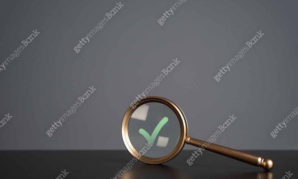 Magnifying glass and green check mark. Pass verification successfully ...