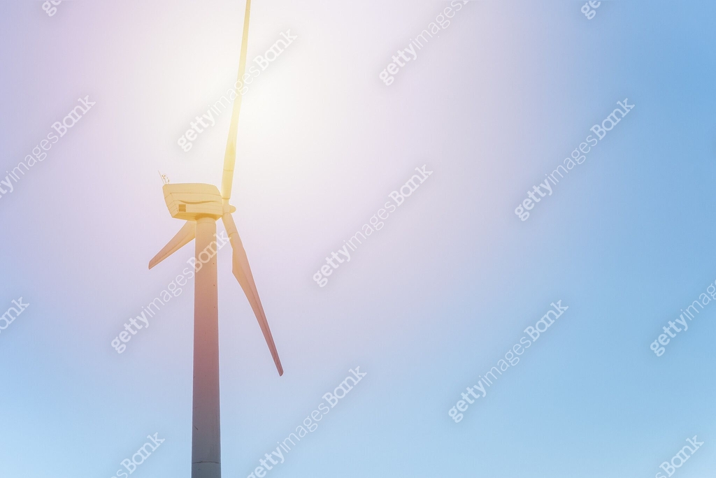 One wind power turbine and sun,blue sky.wind power concept with copy ...