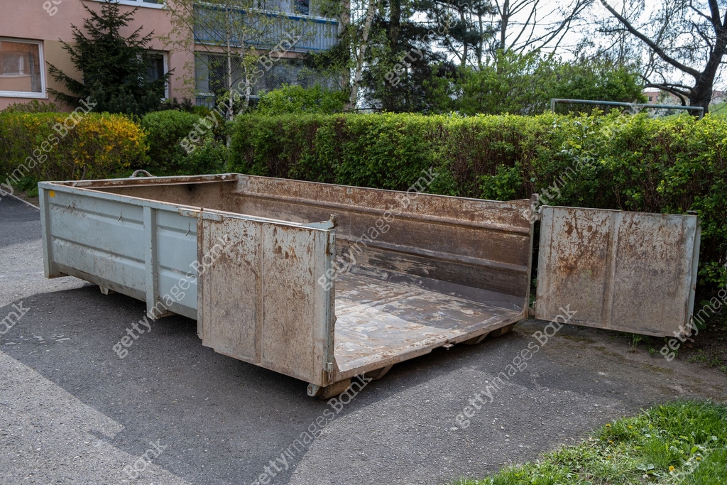 An empty construction waste container ready for materials from a ...