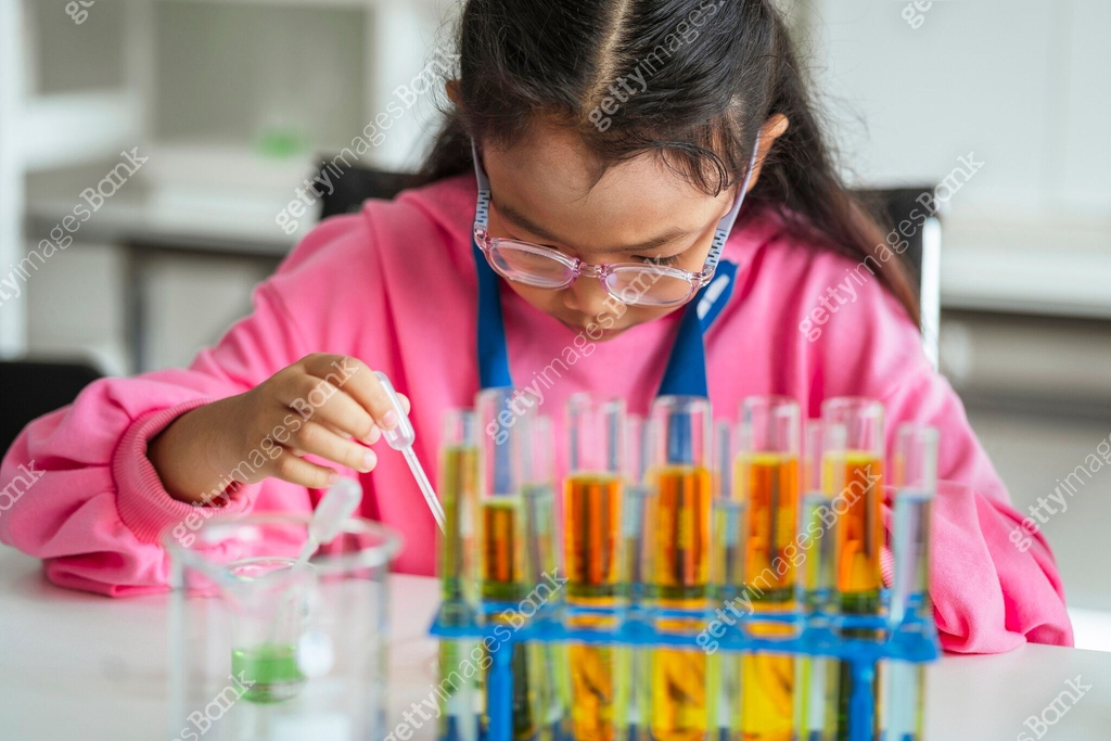 Experiment 548 School children are doing chemistry experiments for classroom learning ...