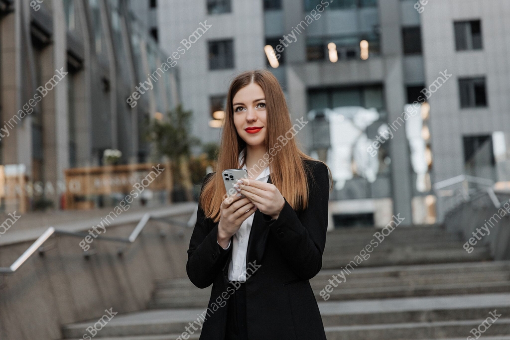 Young business woman wearing black dress code smiling answering message ...