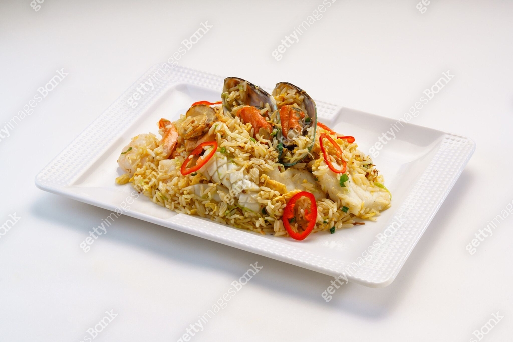 Seafood fried rice include seashell, octopus, prawn shrimp and tomato ...
