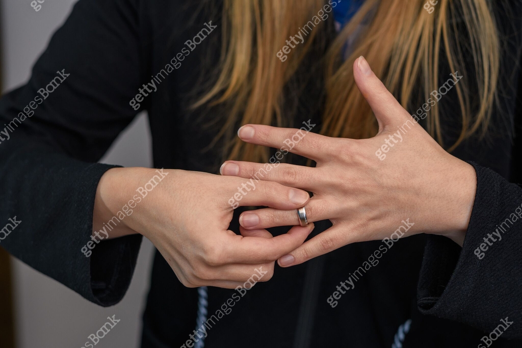 Wife Takes Off The Ring Wedding Ring From The Hand Close up Divorce wife-takes-off-the-ring-wedding-ring-from-the-hand-close-up-divorce