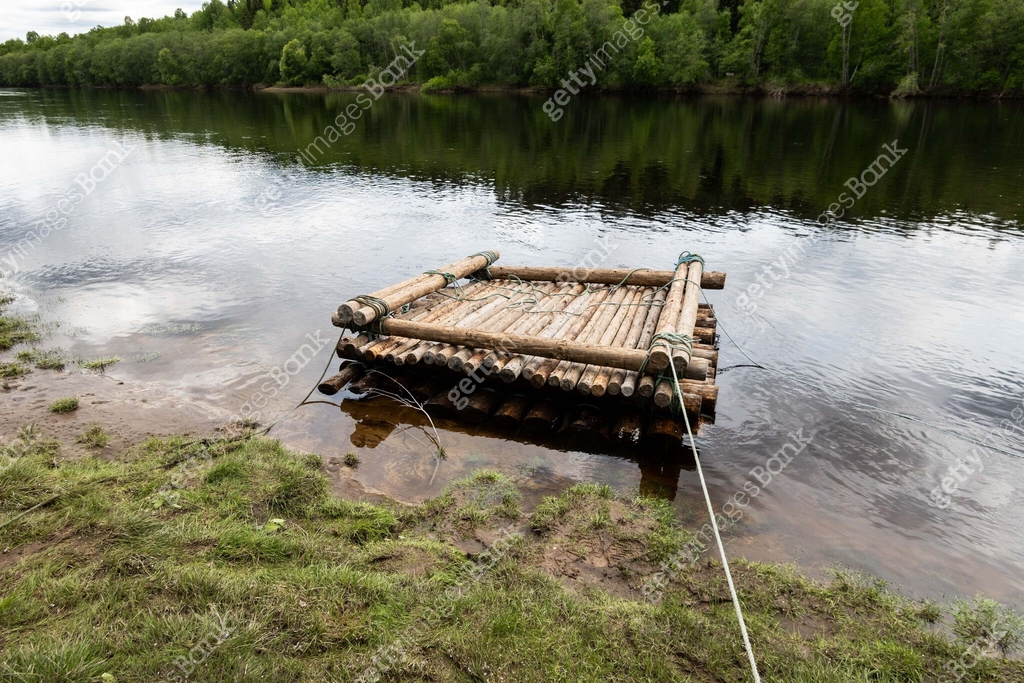 Small Log Raft A custom made log raft floats on the Klarälven River in Värmland ...