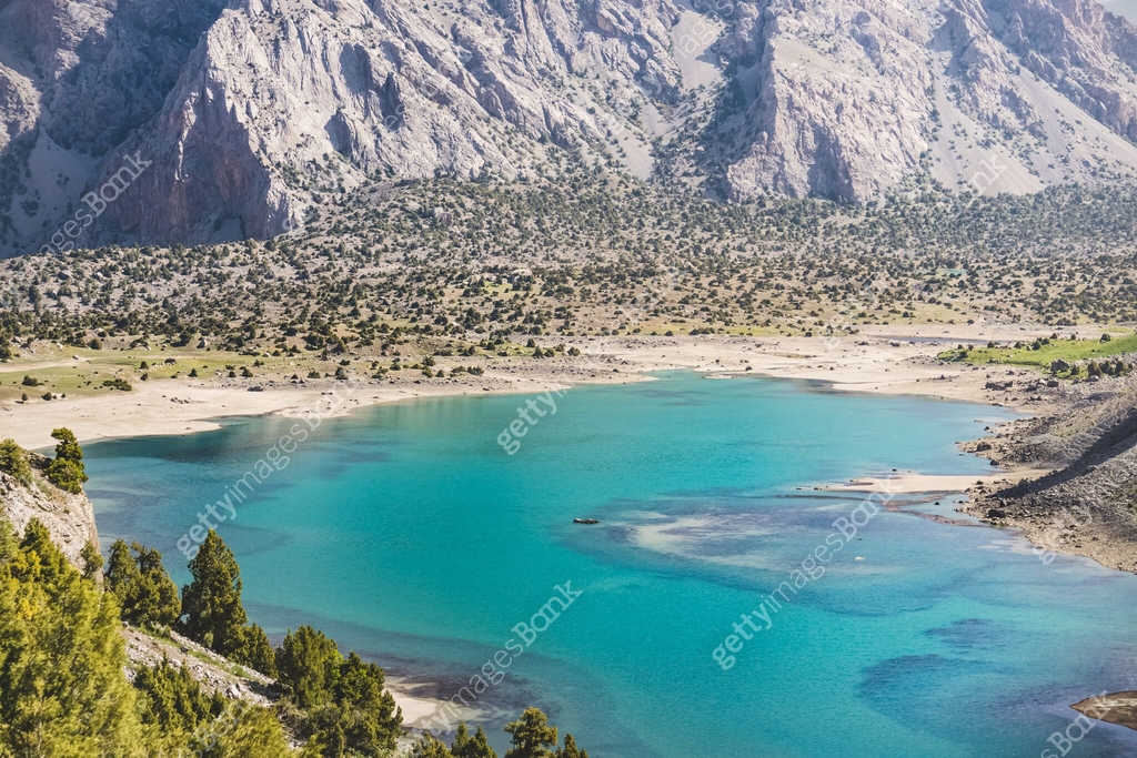 Blue Lake Kulikalon In The Valley Basin From The Height Of The Pass On blue-lake-kulikalon-in-the-valley-basin-from-the-height-of-the-pass-on