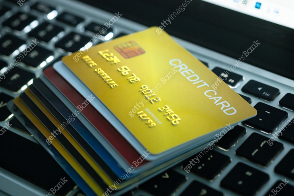 Credit Computer Several credit cards placed on a notebook computer keyboard To pay and ...
