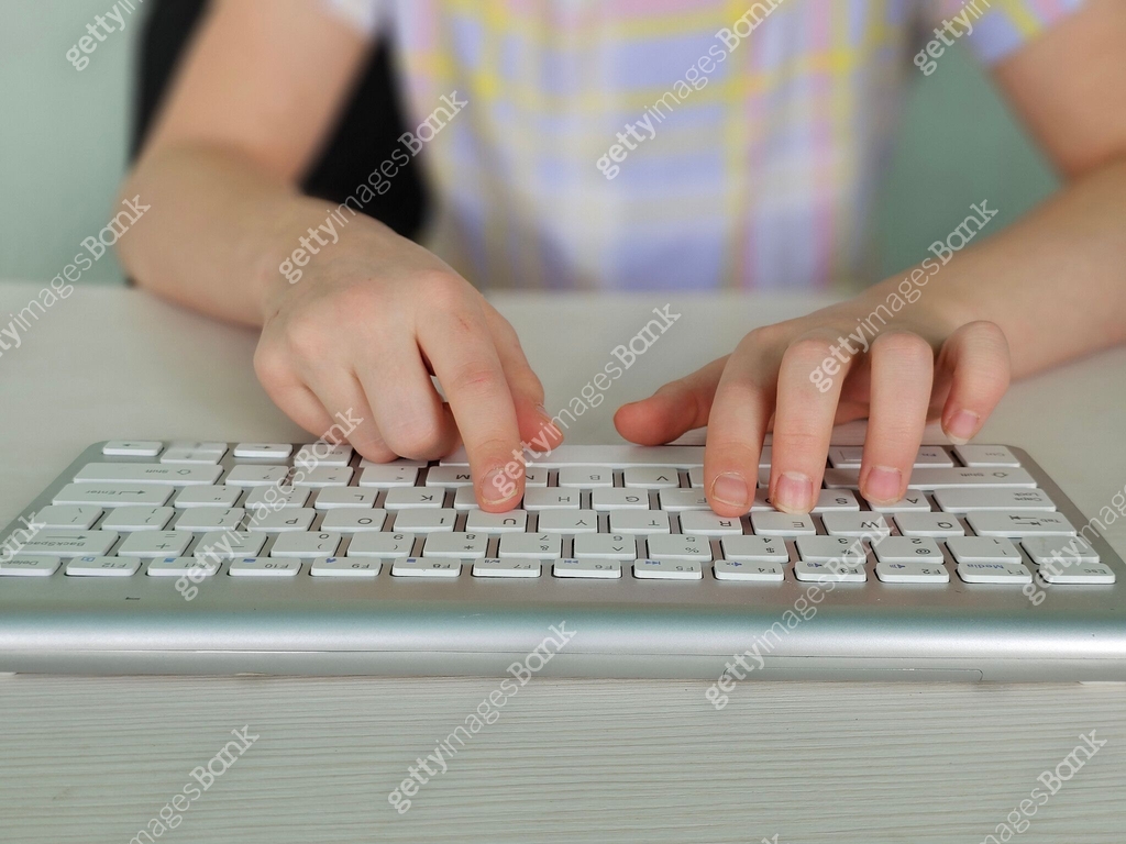 Use Computer Keyboard Kid hands use computer keyboard. Child Hands typing on the pc keyboard ...