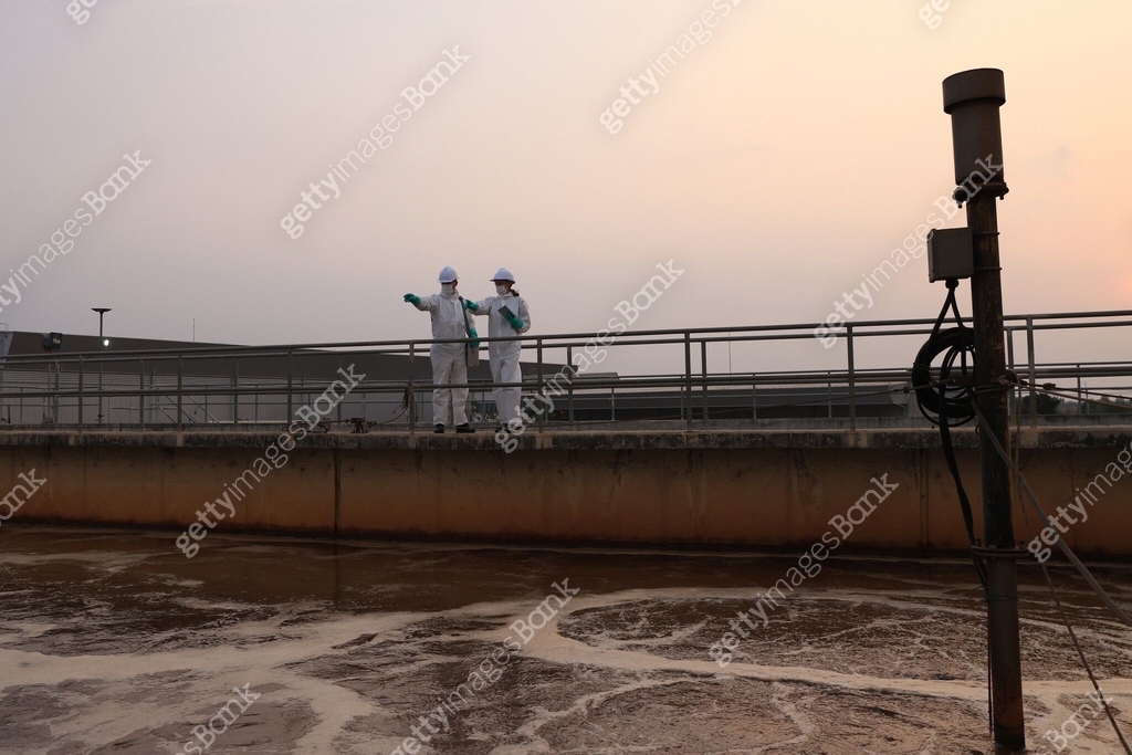 scientist and safety engineer wearing chemical PPE protection work at ...