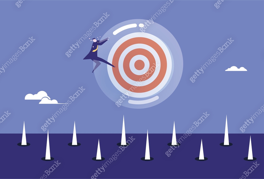 Business man holding the target bubble tightly, afraid of falling on ...