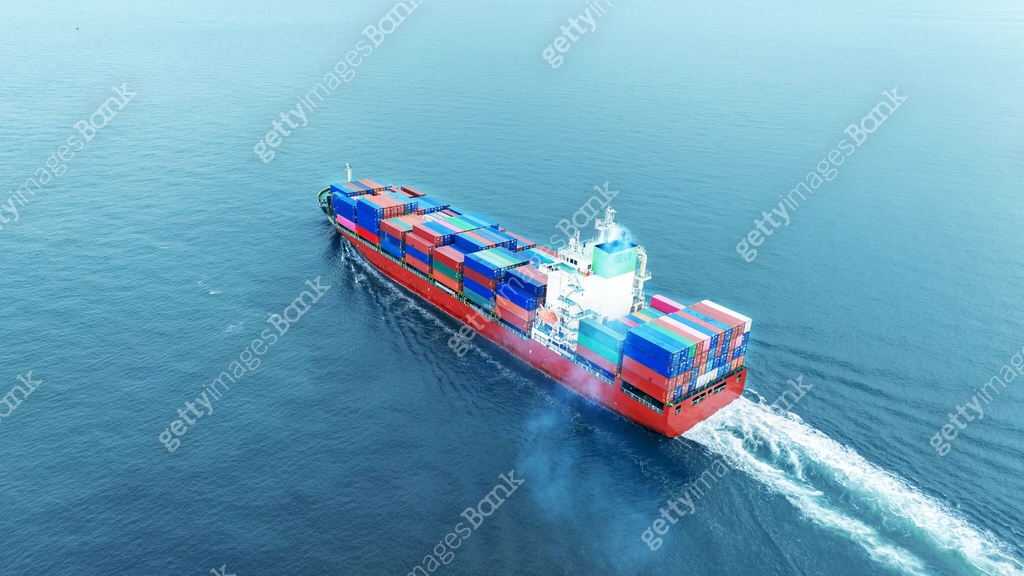 Container Is Running Cargo container ship carrying container and running in the ocean near ...