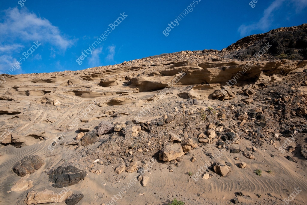 Ventifact rock formations caused by wind at La Pared Beach ...