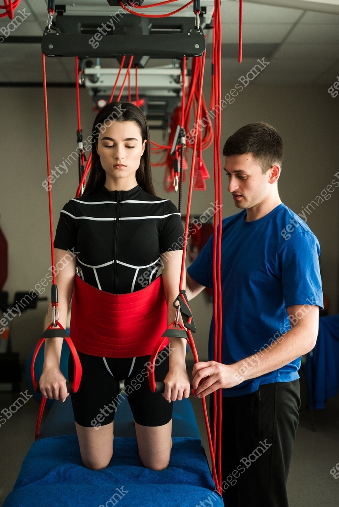 Girl is going through supervised red cord physiotherapy at ...