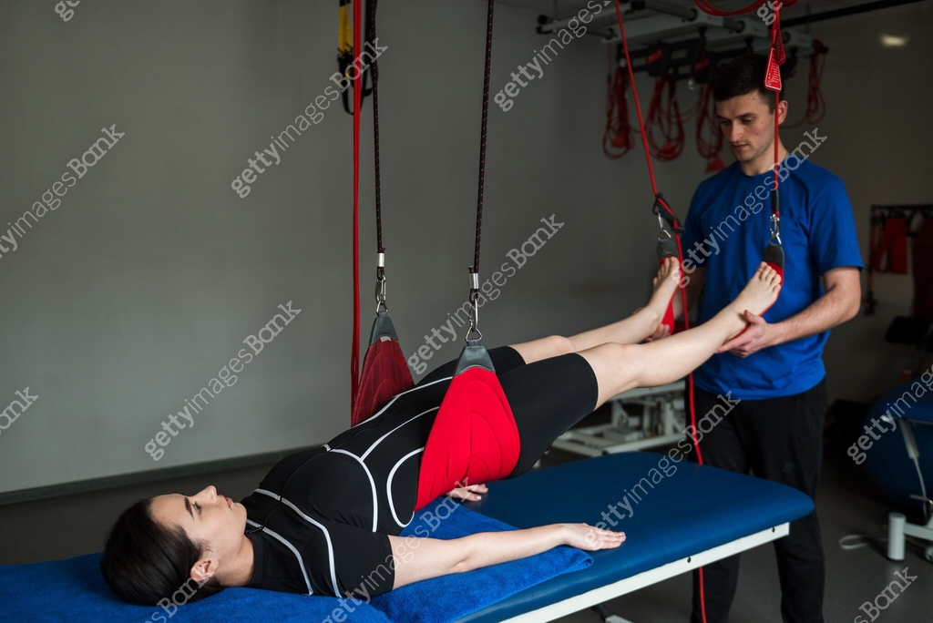 Patient is on red cord therapy to activate small muscles by relaxing ...