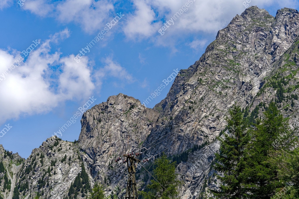 Looking up mountain peaks with cliffs at Italian Alps at City of Merano ...