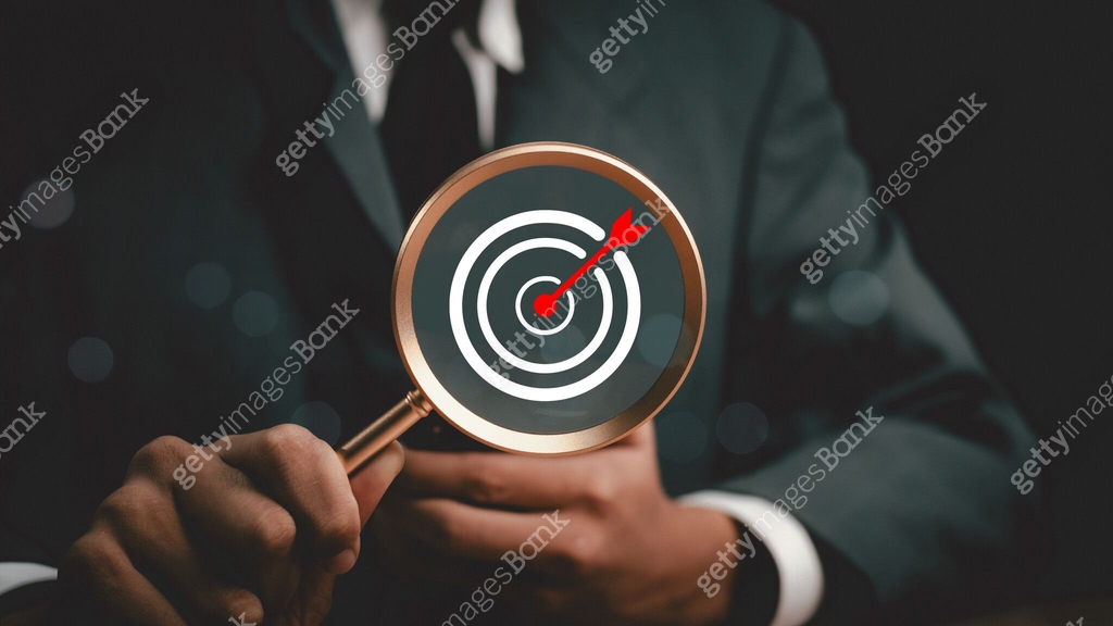 Man hold Target board inside of magnifier glass for focus business ...