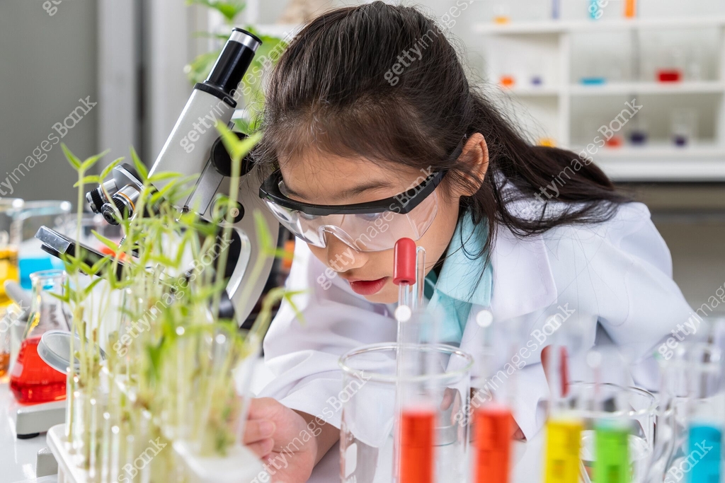 Pupilt Lab Young Asian girl scientist student pupil examining plants with ...