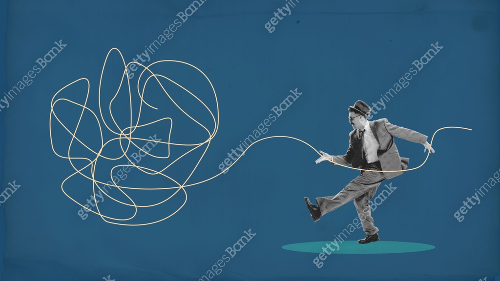 Untangling A Rope Man in suit holding tangled string, symbolizing untangling complexities ...