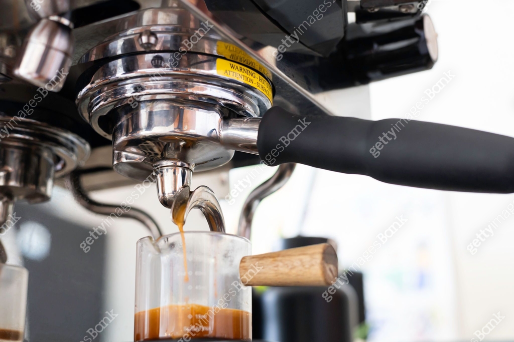 Espresso coffee extraction from coffee machine with a bottomless filter ...