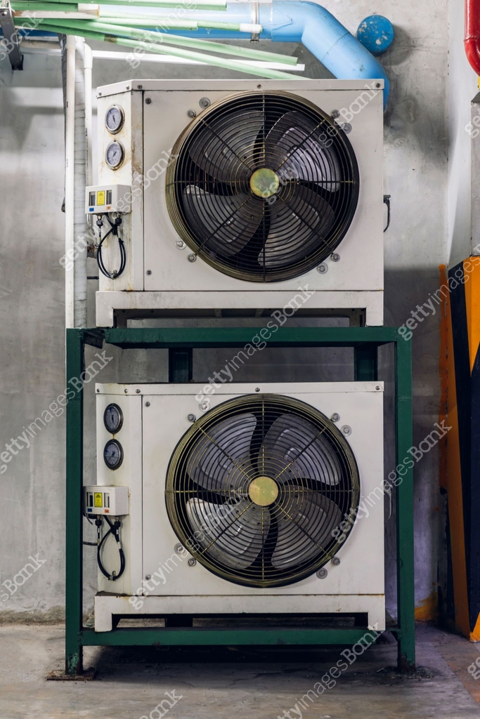 Air conditioner compressor installed in old building. Outdoor split ...