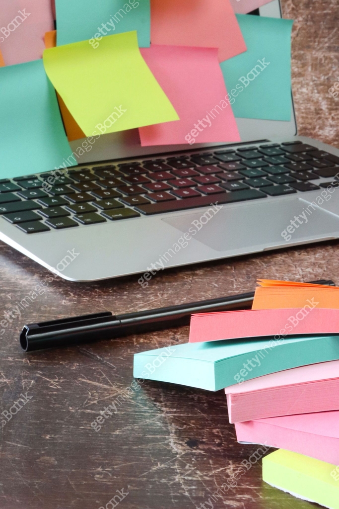Close-up image of open laptop with screen covered in multicoloured ...