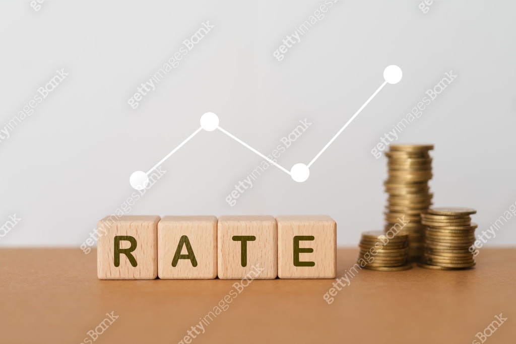Wooden cubes with RATE word, increasing graph with blurred stack of ...