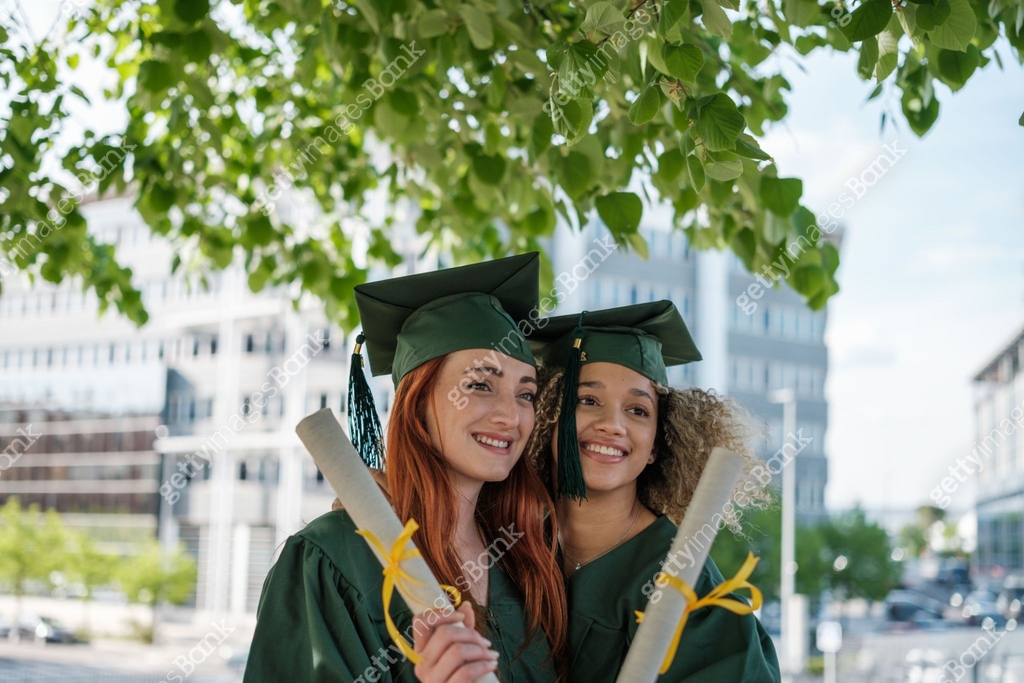 Two young women recently graduated from the university showing their ...